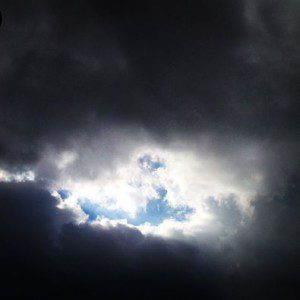 Dark clouds with a bright opening sky.